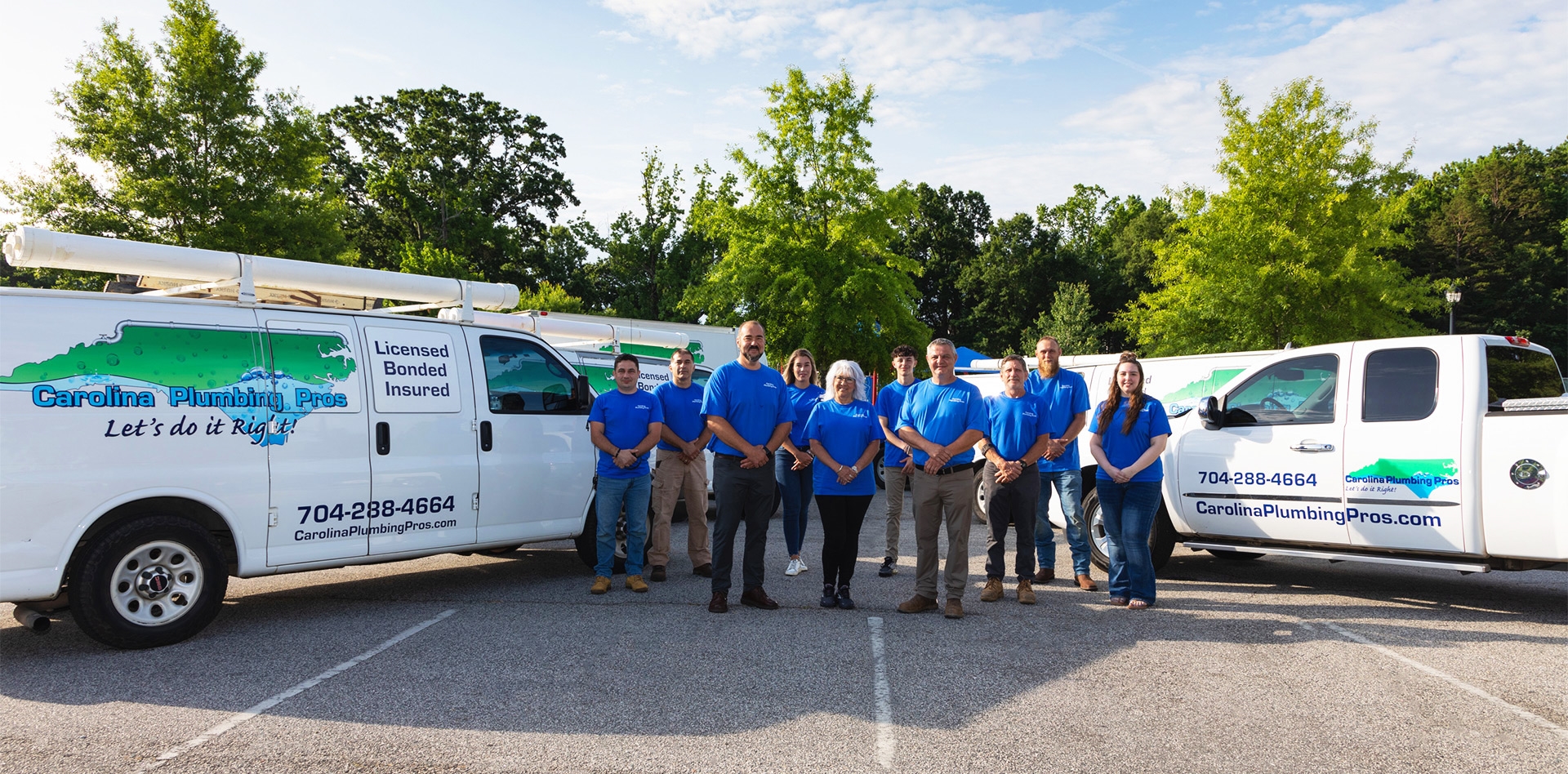 Carolina Plumbing Pros team in front of service trucks